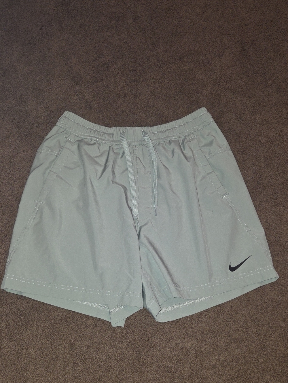 Nike Men's Light Green Athletic Shorts with Black Swoosh Size Small